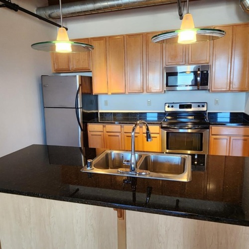 a kitchen with a stainless steel sink