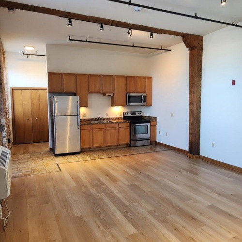 a kitchen with a wood floor