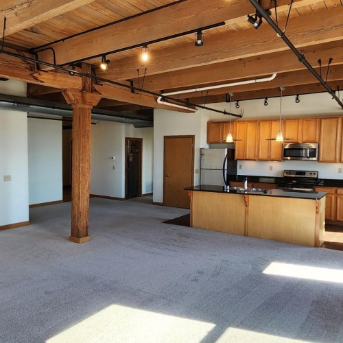 a large kitchen with wood cabinets